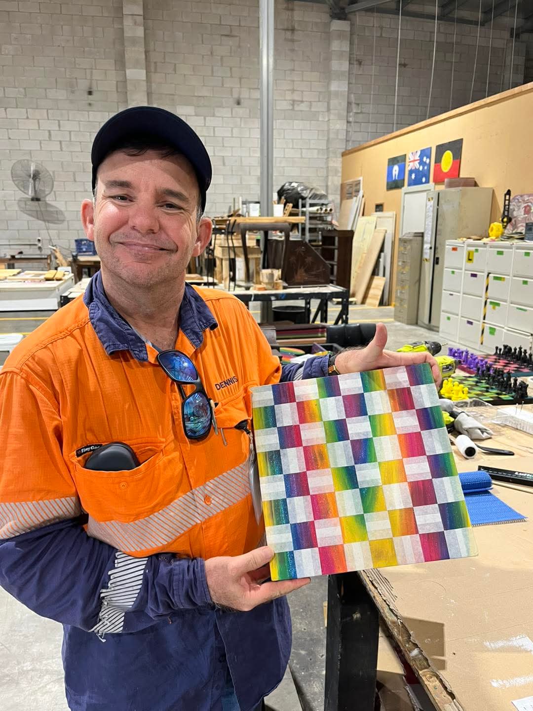 Participant proudly showing a finished creative workshop project